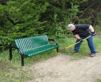 Flower-planting on walking trail along Mitchell Lake